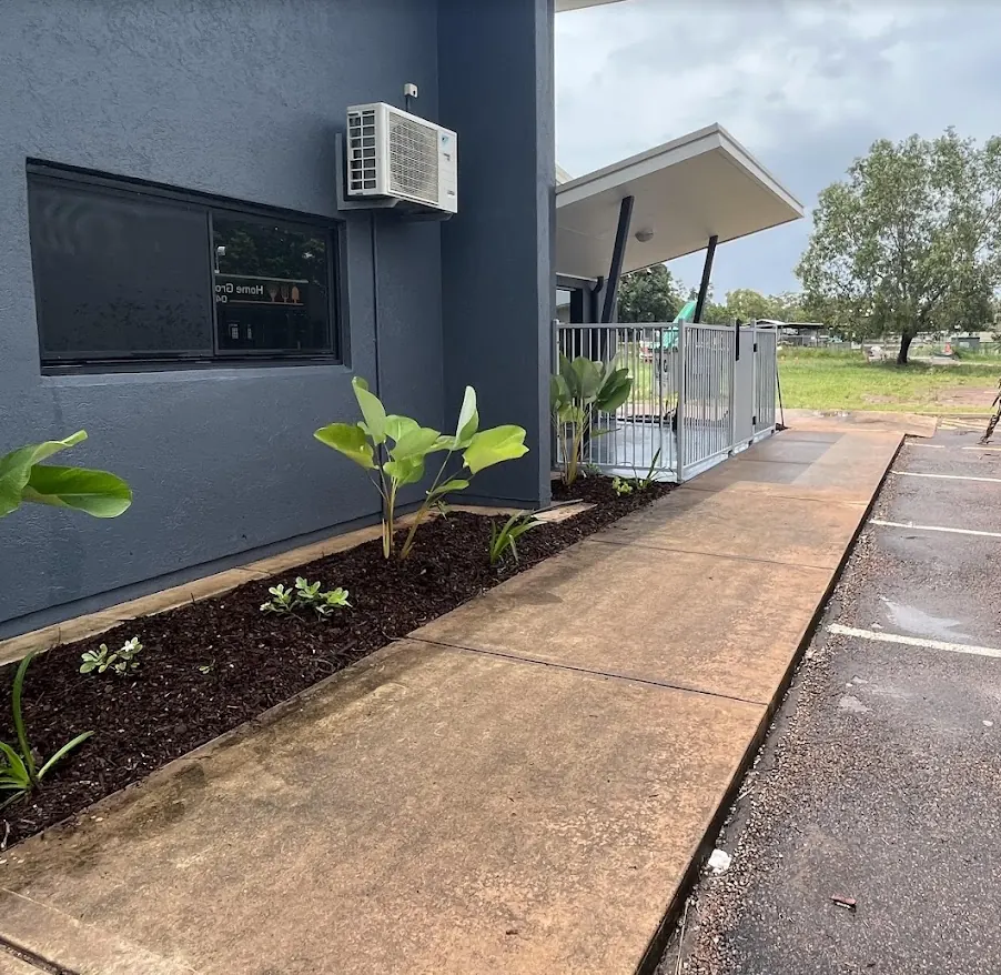 Path-side garden bed cleanup and mulching — Harkaway. Long path-side bed cleared of weeds, replanted and topped with fresh mulch.
